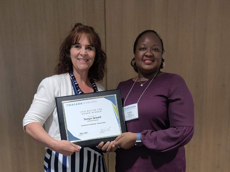 Tonya Jewell (left) with award presenter.